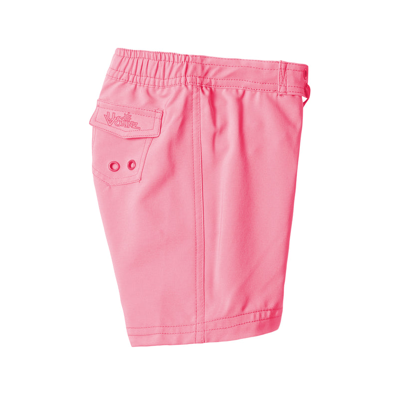 side view of the girl's board shorts in bubblegum|bubblegum