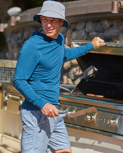 Man Grilling Hamburgers in UV Skinz's Bucket Hat|midnight-grey