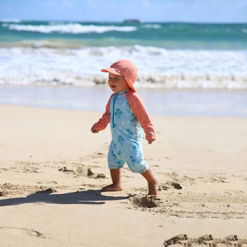 Baby in UV Skinz's baby UV swimsuit in beach trees|beach-trees