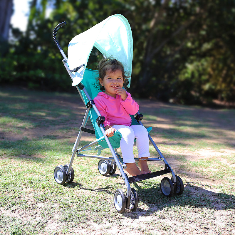 Baby Girl in Stroller in UV Skinz's Baby Bamboo Sun Legz™ in White|white