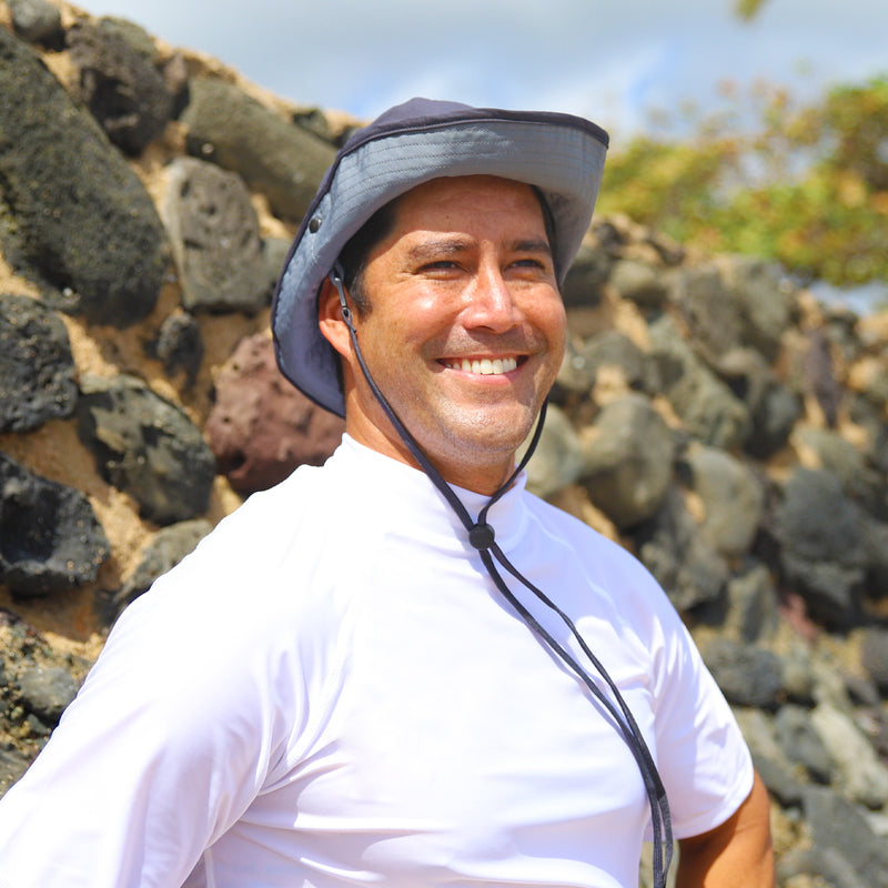 Man wearing UV Skinz's men's bucket hat with drawstring|charcoal-grey