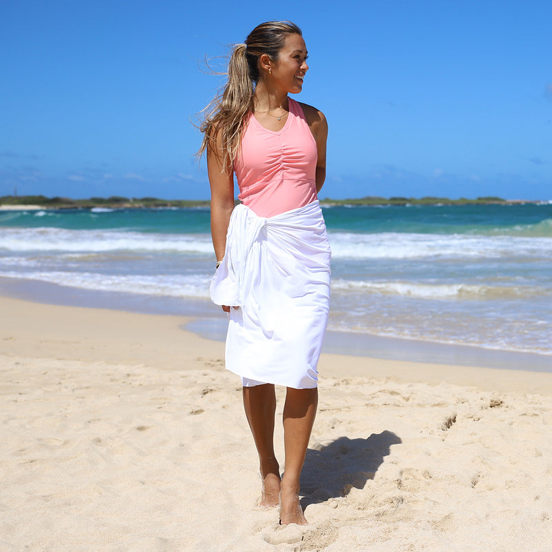woman wearing UV Skinz's beach cover upin white|white