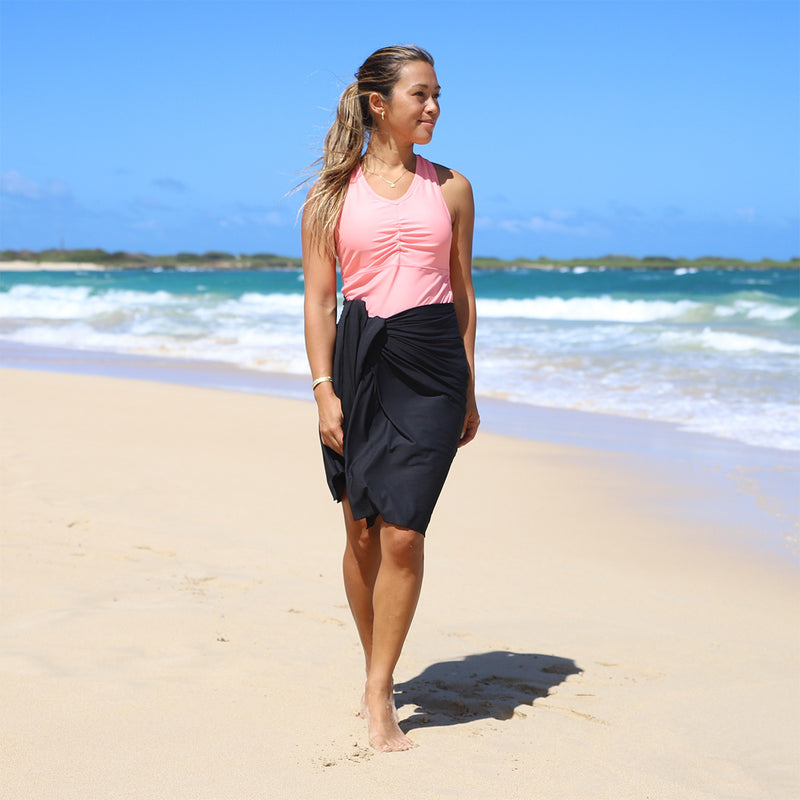 woman in UV Skinz's beach coverup in black|black