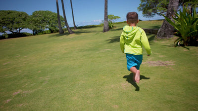Little Boy Playing on the Beach in UV Skinz's Boy's Classic Board Shorts in Royal|royal