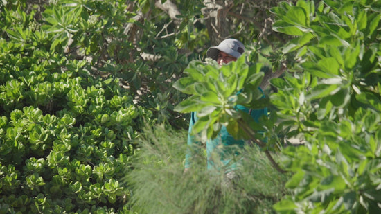 Man wearing the wide brim sun shade hat at the beach