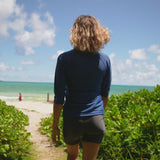 Woman in UV Skinz's Women's V-Neck Sun & Swim Shirt Wading Through the Water