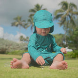 Baby Boy Playing with Bubbles in UV Skinz's Baby Boy's Swim Flap Hat