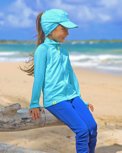 Little girl in UV Skinz's kid's active fleece hat in scuba blue|scuba-blue