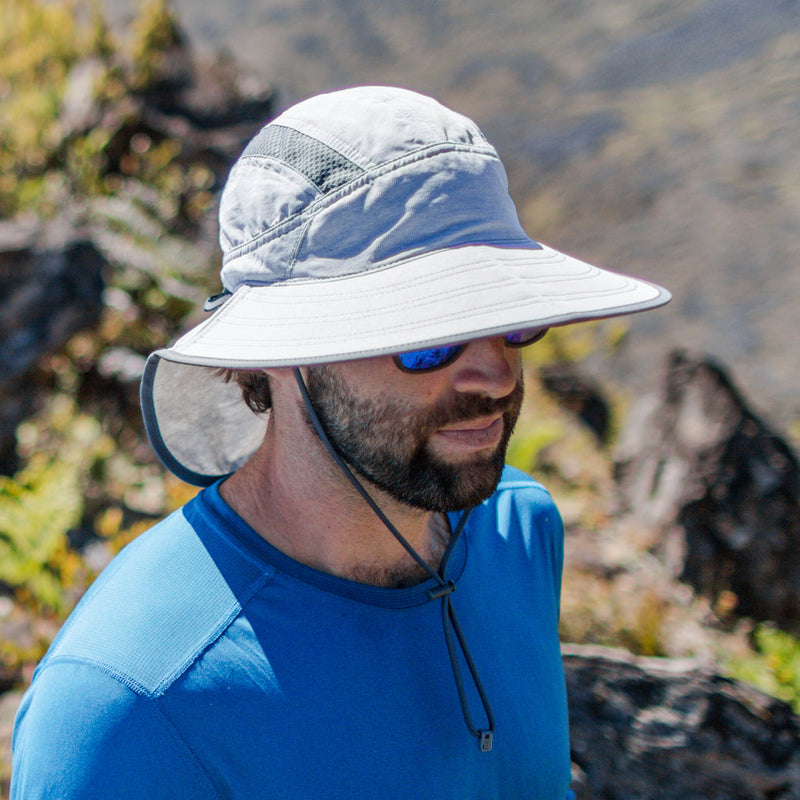Man on a hike in the ultra adventure hat|blue-mountain