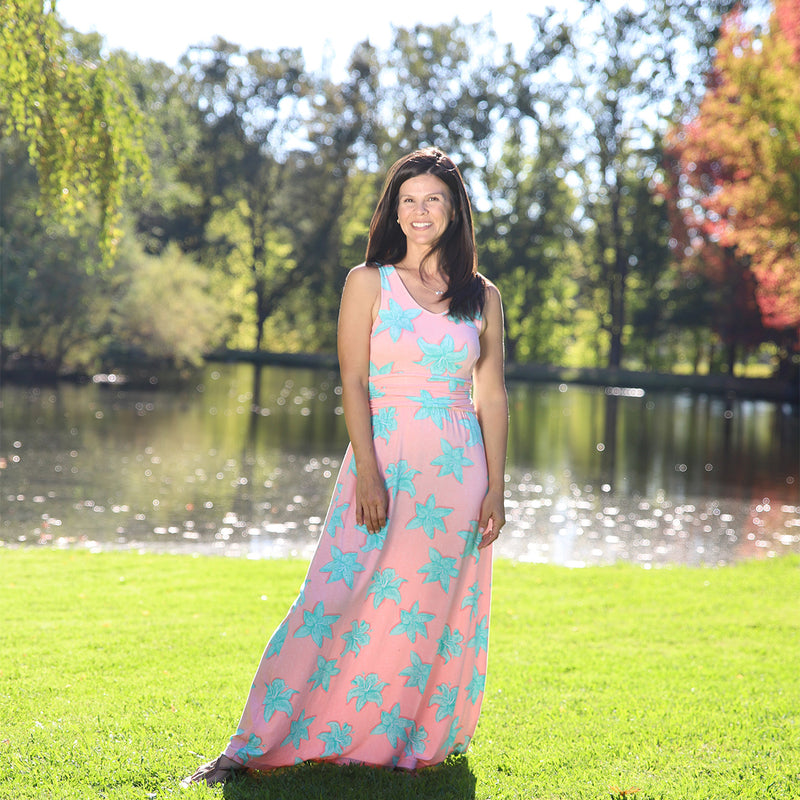 woman in UV Skinz's maxi dress in vintage lily|vintage-lily